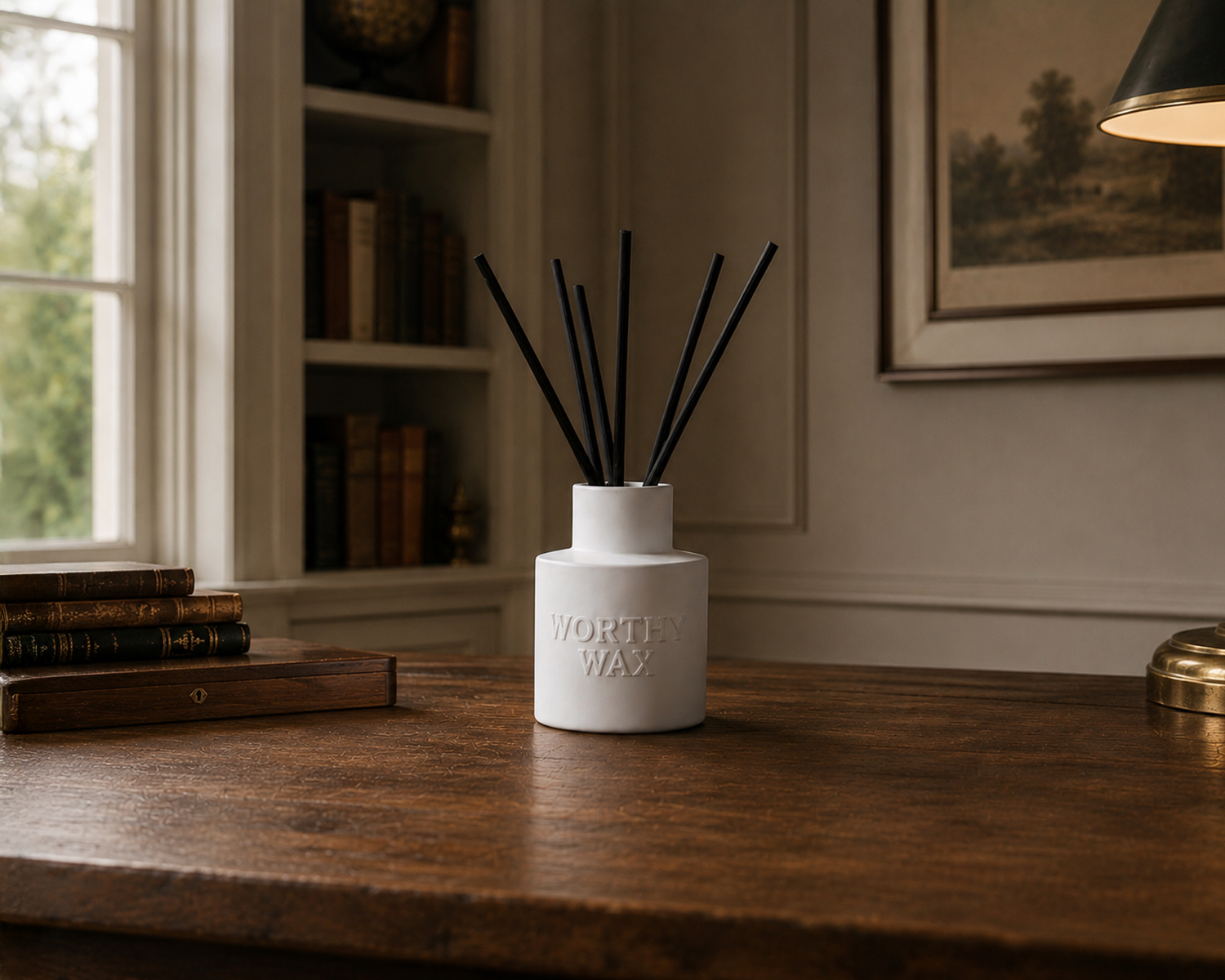 The Gentleman's Study reed diffuser with black reeds in a matte ceramic Worthy Wax bottle